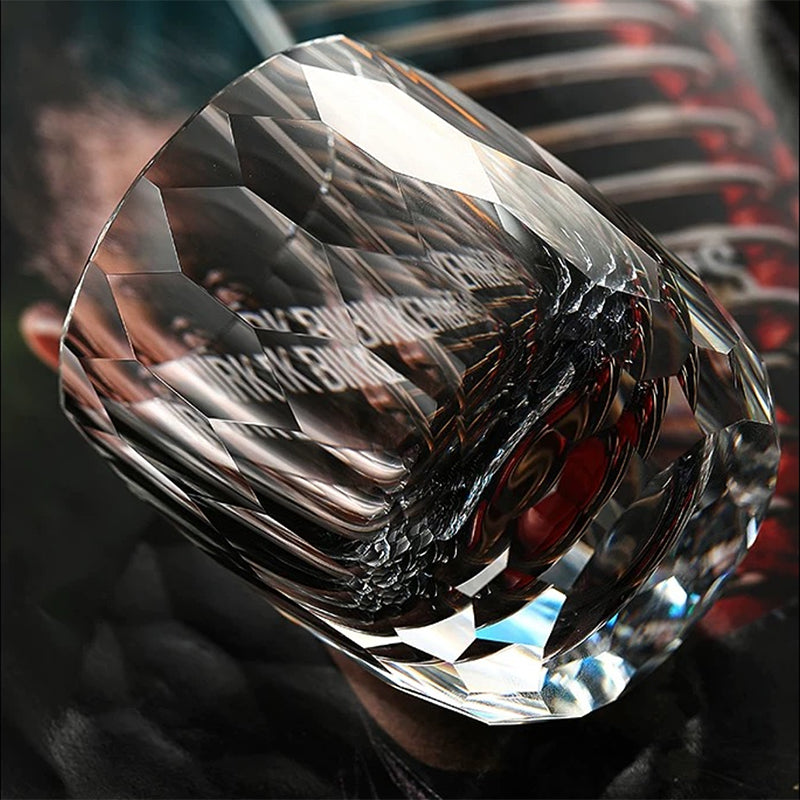 Hand cut crystal whiskey glass with precision-cut facets reflecting light