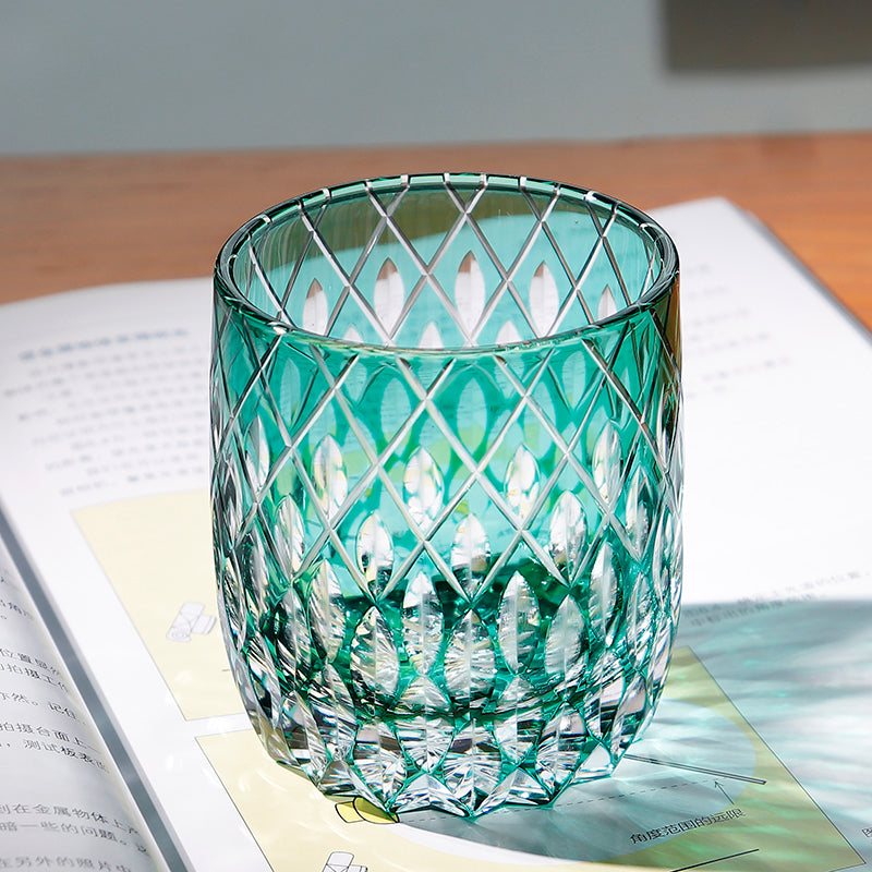 Emerald green overlay diamond lattice leaf hand‑carved glass tumbler, dual‑tone cut facets