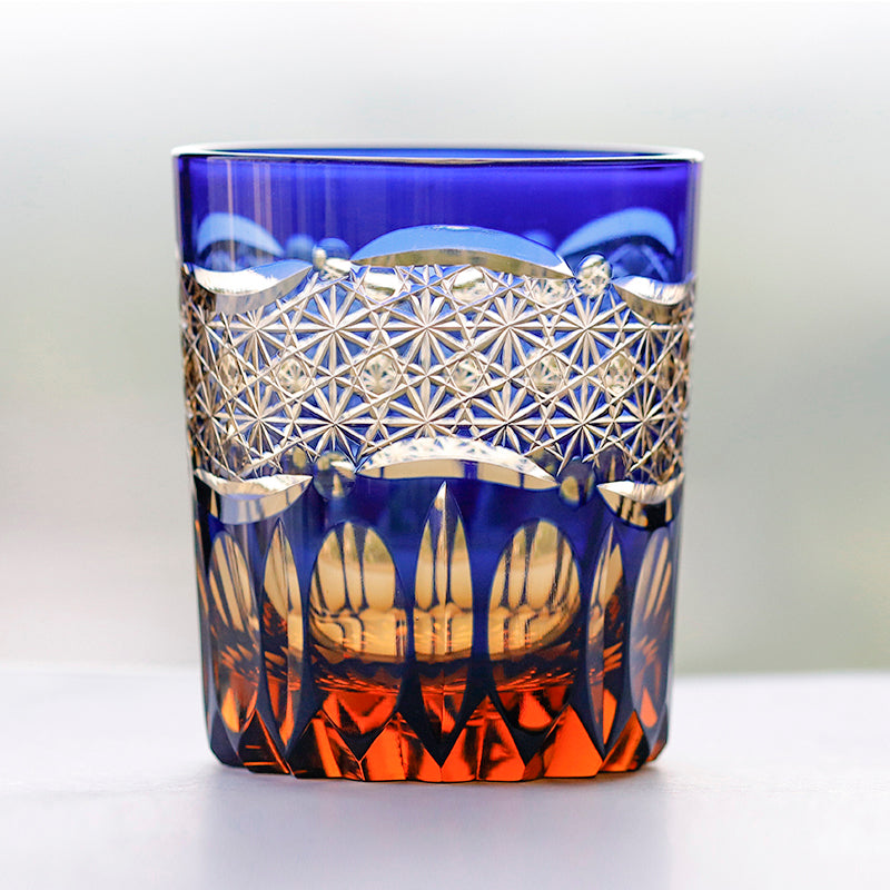 Primary image of 250 ml  Japanesque Style Blue and Amber Color Cased Glass Whiskey Tumblers with Hand Carved Mountain and Lotus Design - hand-cut crystal glassware