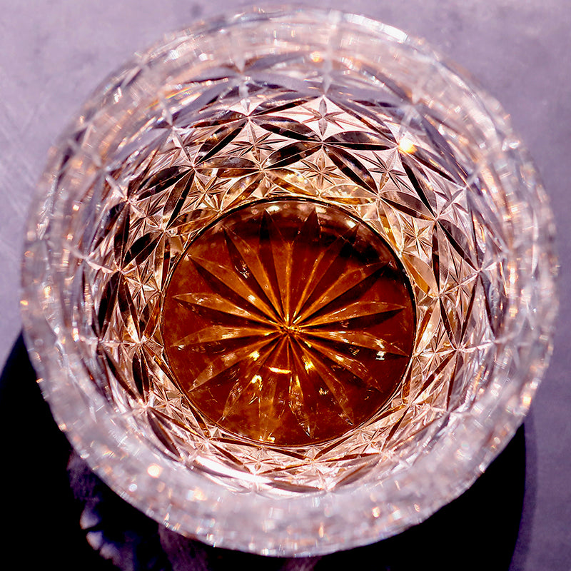 Close‑up of hand‑cut diamond facet carving on K9 crystal tumbler glass